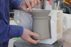Removing slip cast stein mug from mold